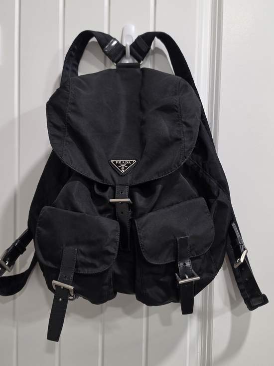 Prada Handbags - Prada Black Nylon Flap Backpack with Dual Front Buckle Pockets